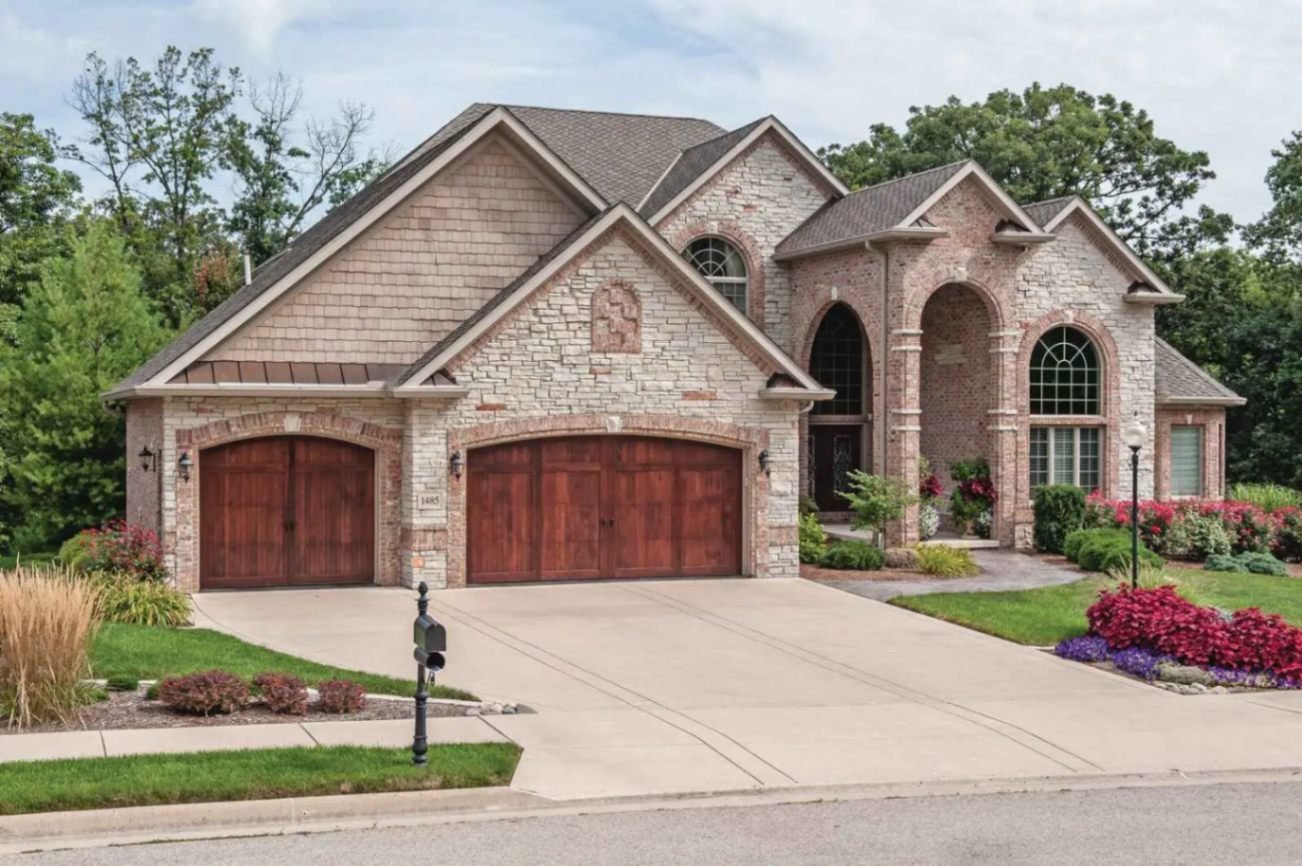 Overlay Carriage House Wood shown in Cedar with Wrought Iron hardware.